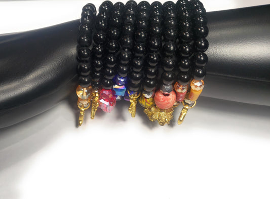 Black Beaded Bracelets with Various Accent Colors and Charms on Elastic Cord